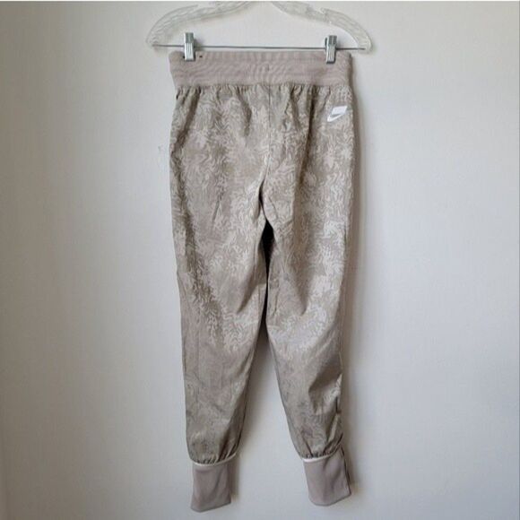 NIKE NSW Jacquard Satin Cuffed Track Pants Cream All Over Print Size XS - Picture 11 of 11
